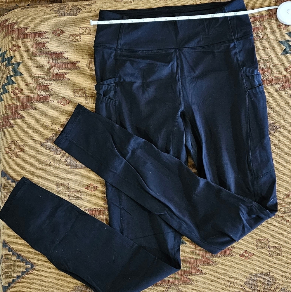 Fabletics black leggings with mesh pockets on the sides